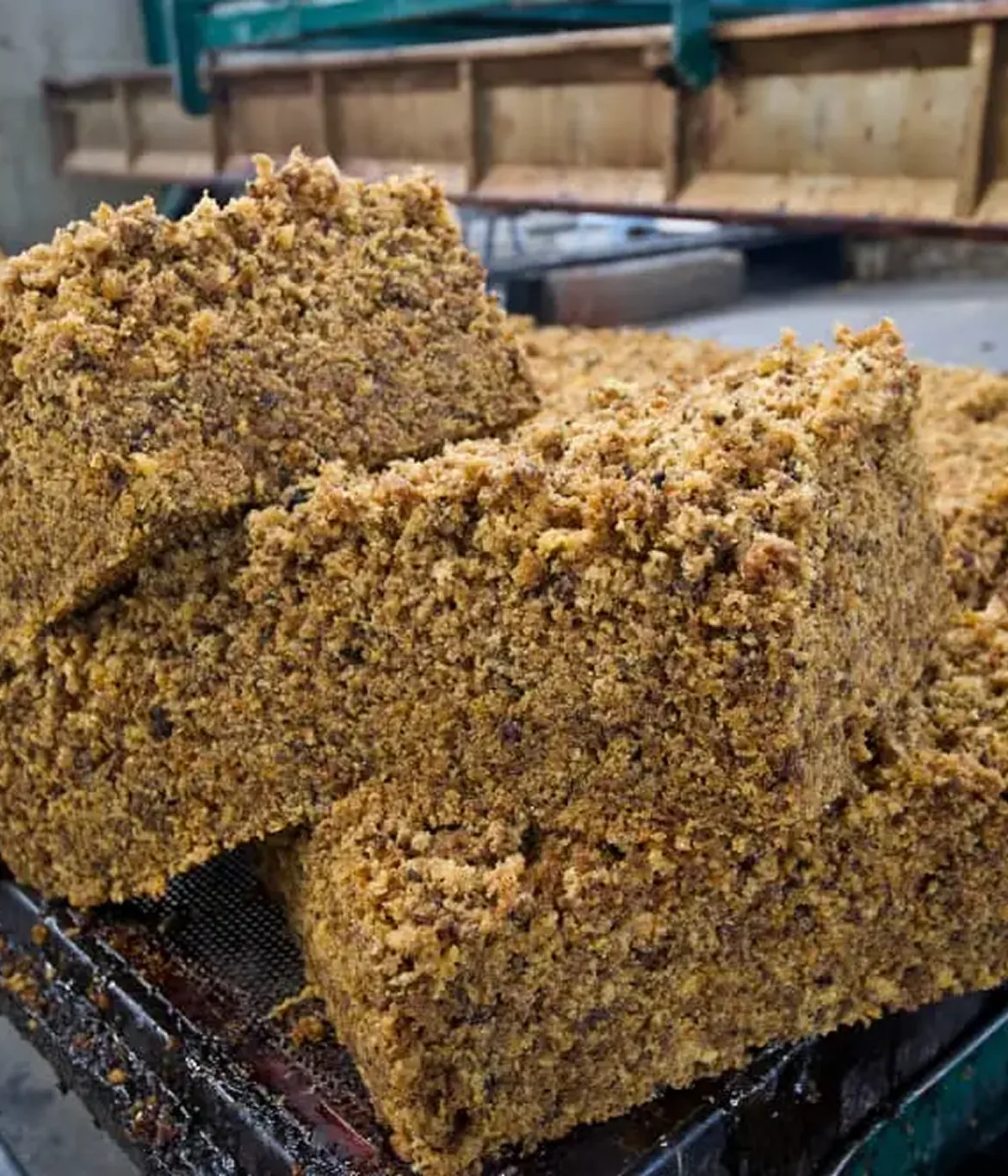 Pressed blocks of natural crumb rubber